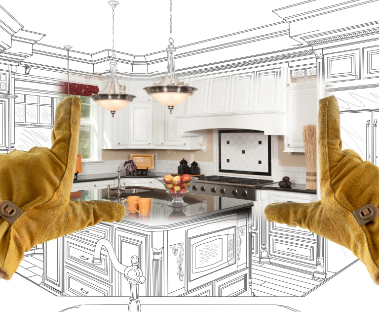 A pair of yellow gloved hands make a box around a set of drawn kitchen renovation plans.