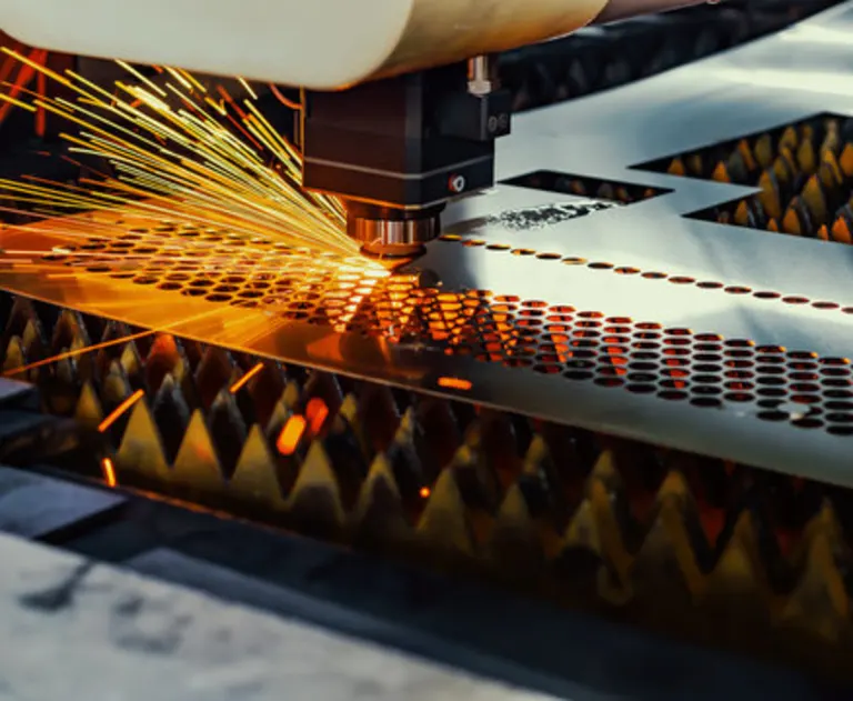 A laser cutting a sheet of metal.