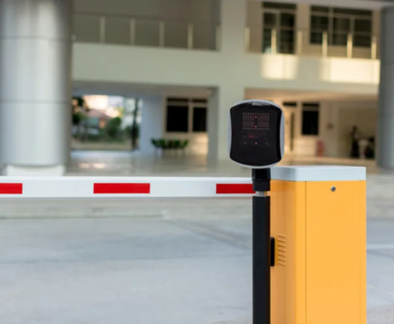 This is a car park automatic entry system used for security and access control. It consists of a motorized barrier arm (also known as a boom barrier) that rises and lowers to control vehicle flow.