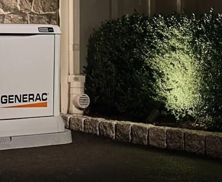 The item pictured is a Generac home standby generator, designed to automatically provide backup power during utility outages.