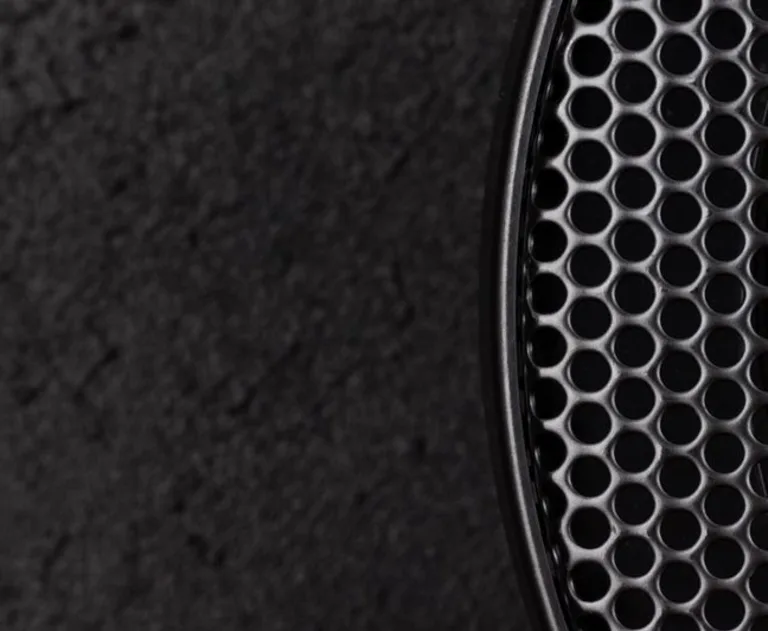 A closeup image of a speaker grille.