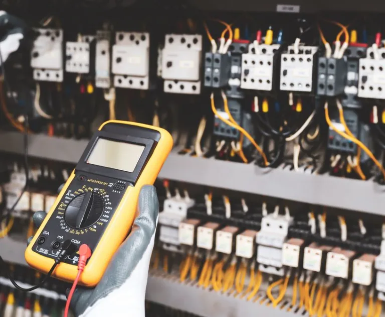 The item shown is a digital multimeter, a versatile tool used by professionals and DIY enthusiasts to troubleshoot and verify electrical systems.