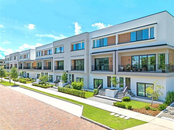 The exterior of a multi-level townhouse complex in Florida.