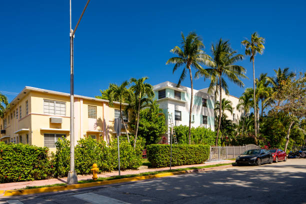 The image displays a multi-family apartment building located in the South Beach neighborhood of Miami, Florida.