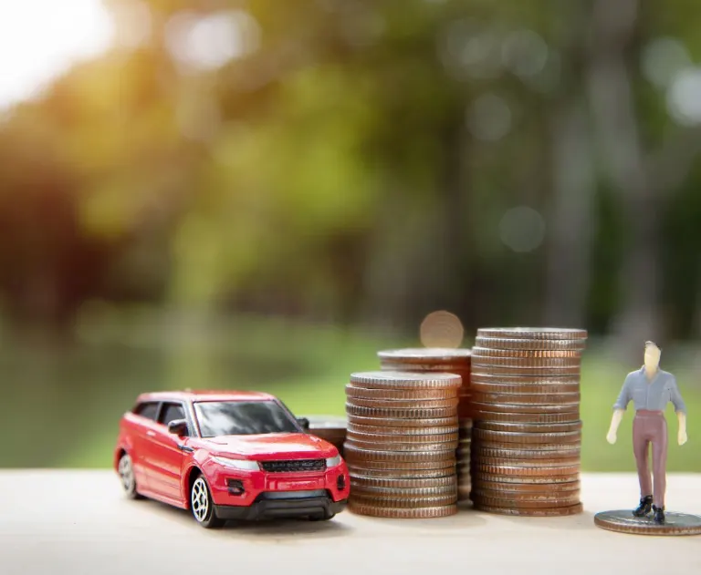 This image symbolizes the financial aspects of vehicle ownership, such as saving money to buy a car or getting a rebate for an electric vehicle.