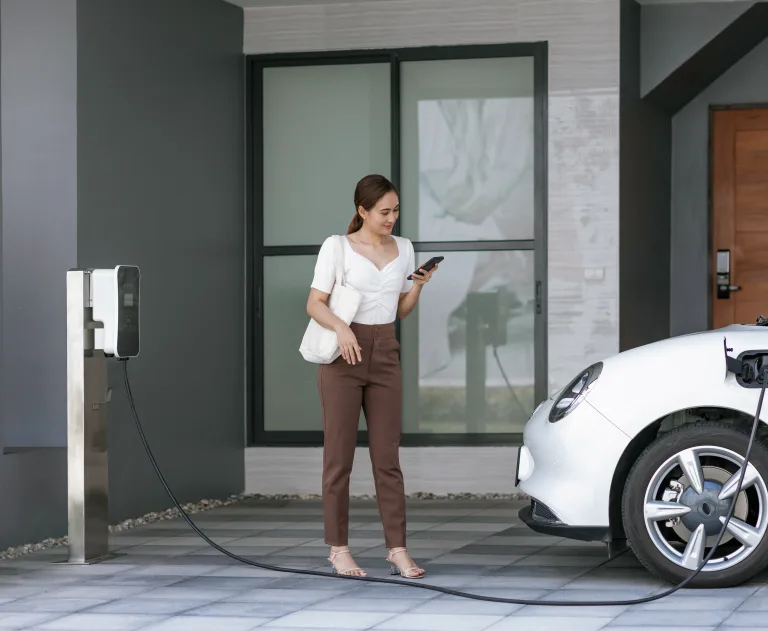 This image depicts a residential electric vehicle charging station set up in a home garage.