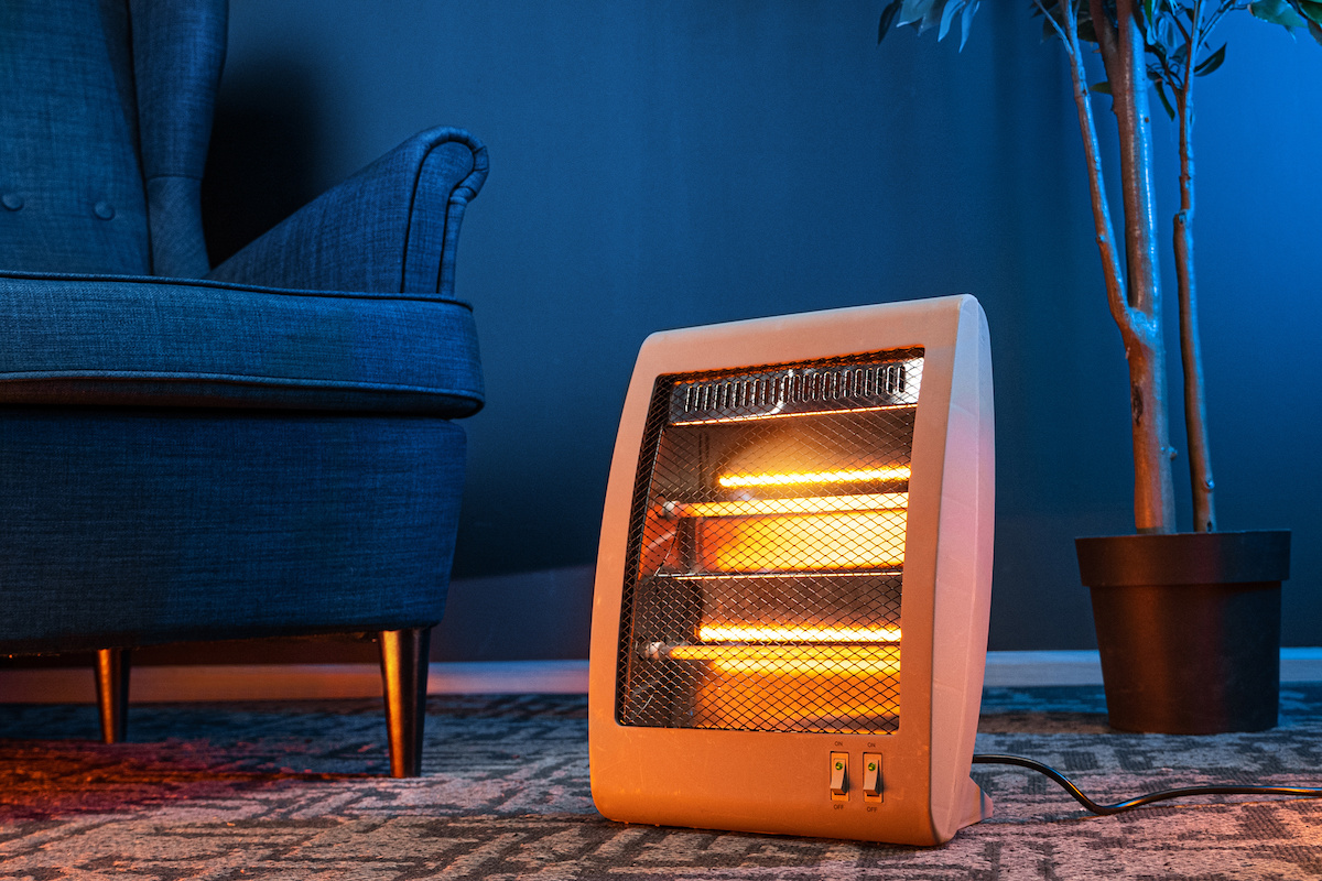 This item is a portable electric space heater designed for supplemental indoor heating. It uses a resistive heating element (glowing coils) to generate heat.