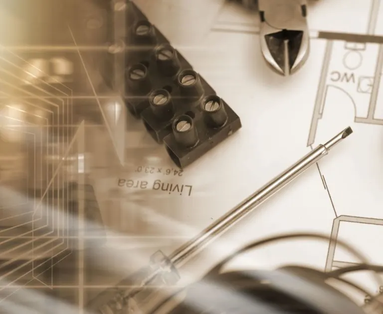 This image depicts a professional electrical project layout and tools.