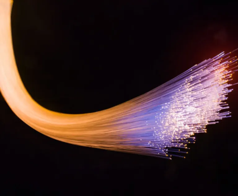 This image shows fiber optic cables, which are thin strands of purified glass or plastic used to transmit data as pulses of light.