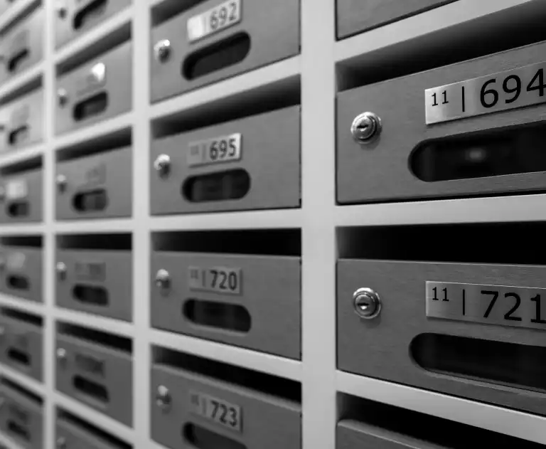 AdobeStock_399055481 - Thomas Edison Electric This is a row of modern apartment mailboxes.These mailboxes feature individual metal slots, each secured by a keyed lock.The numbering system helps residents quickly identify their specific mailbox.