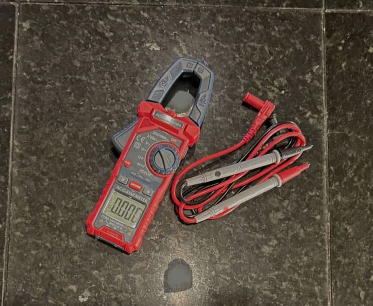 This image shows a clamp meter, designed to measure AC current without interrupting the circuit.