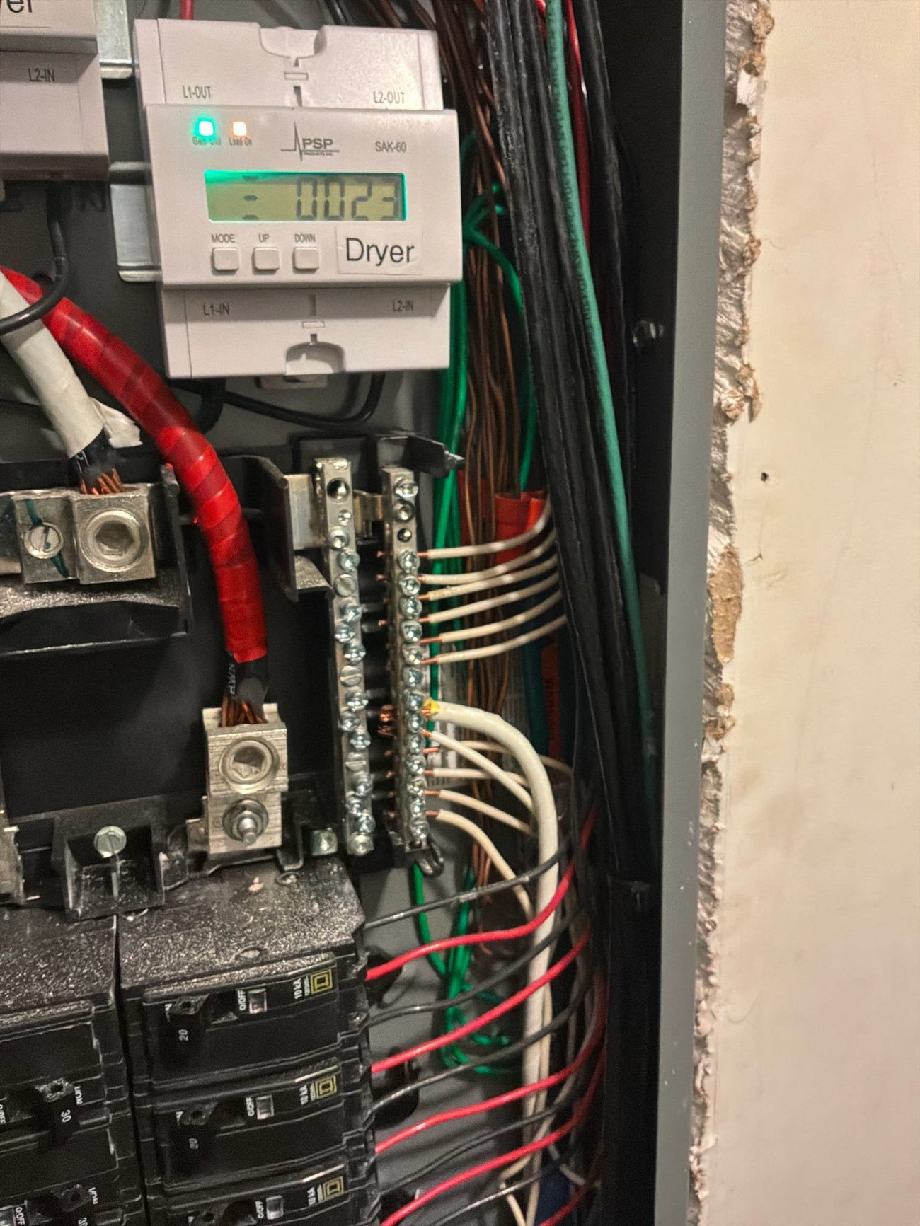 Load-management module on the dryer circuit with conductors landed on the bus