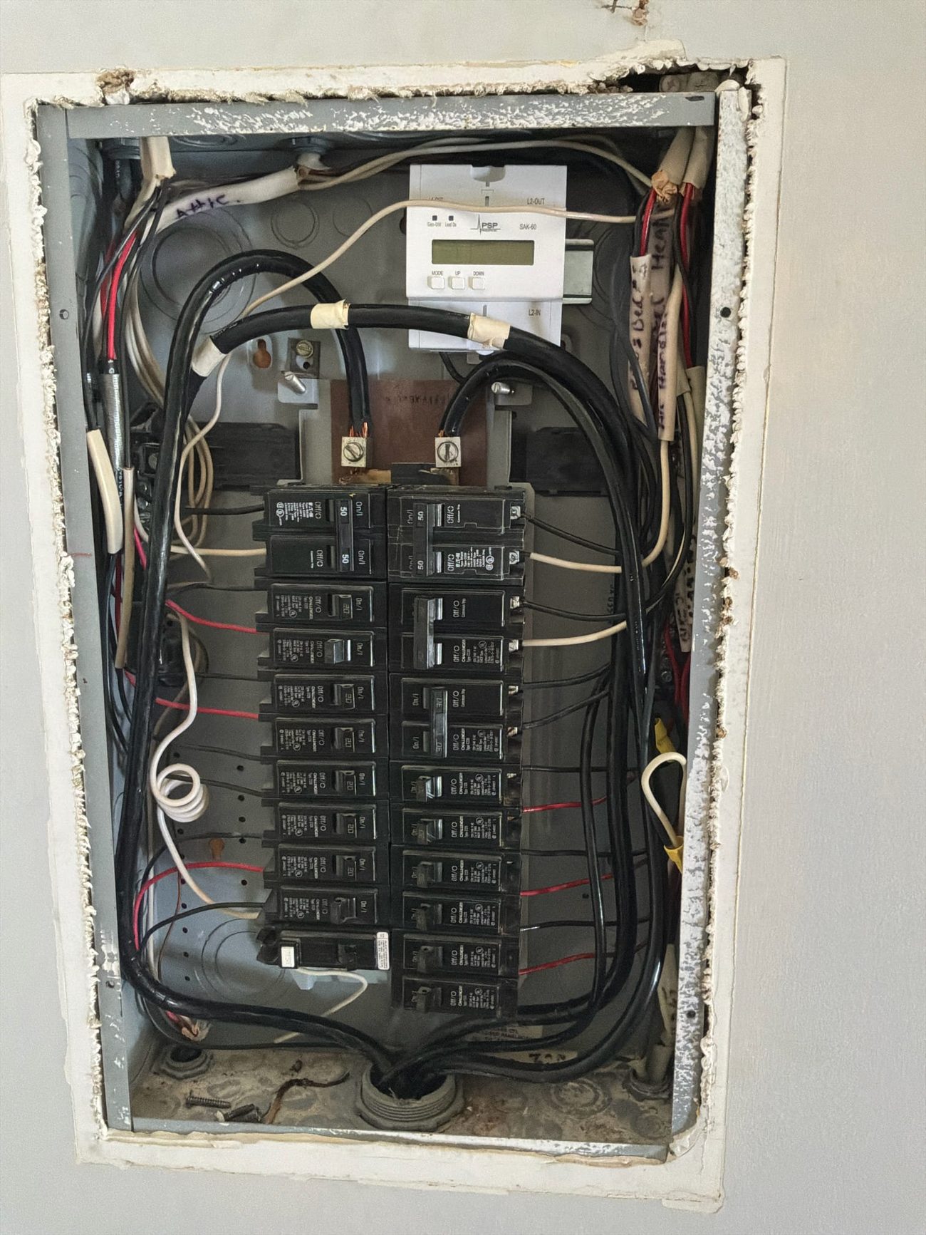 GE 150 amp main panel interior found during the Palm City electrical safety inspection