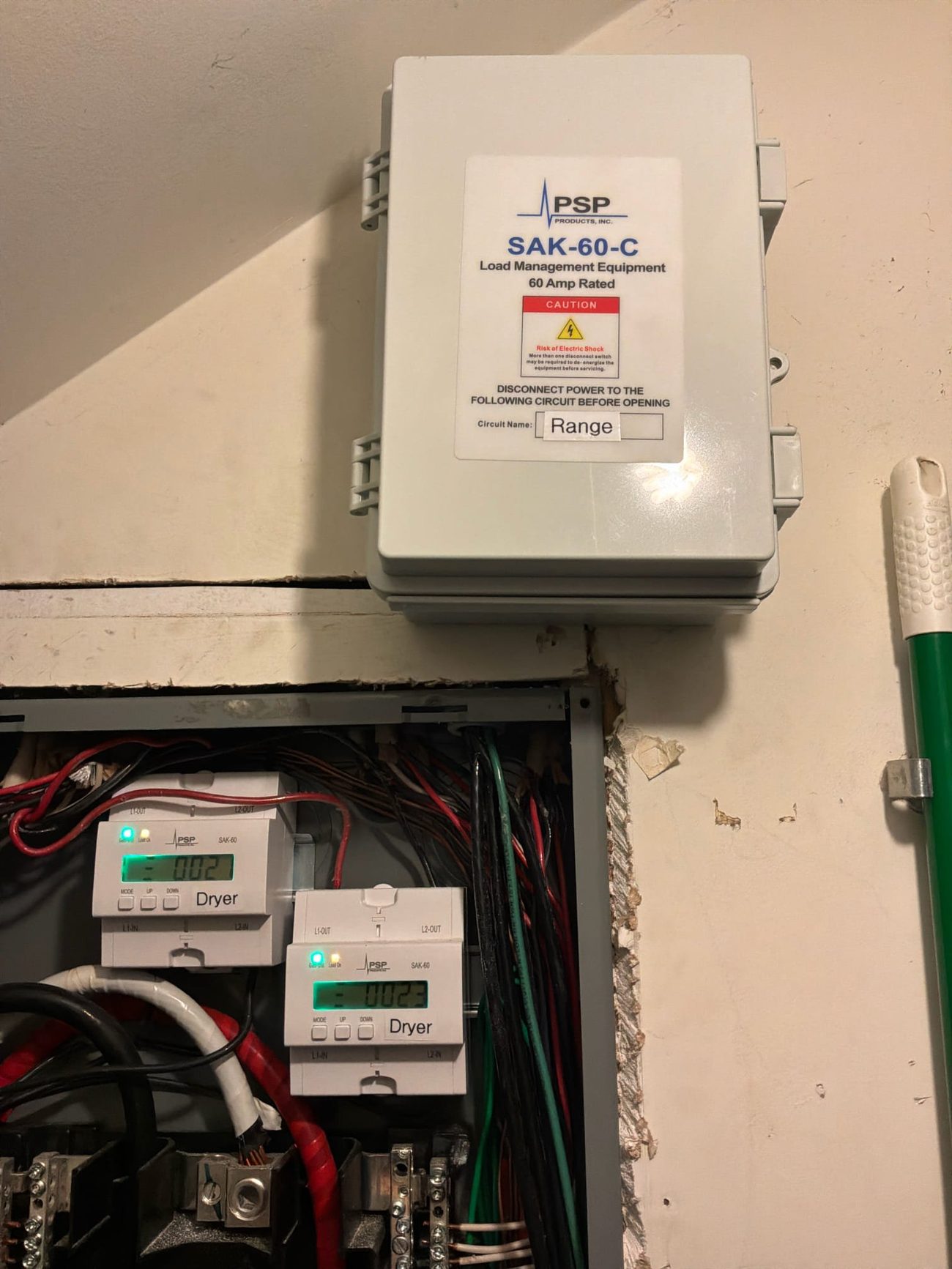 Installed PSP SAK-60 load-management equipment labeled for the range circuit in Palm City