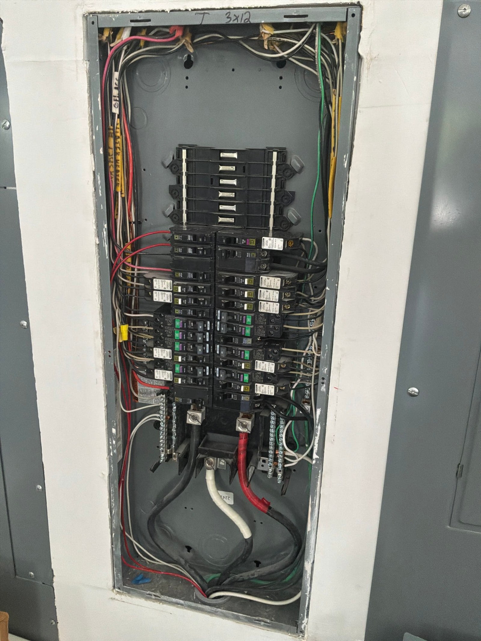 The inside of an electrical panel documented before the work on an Electric Fixture Service/Repair job in Jupiter, FL.