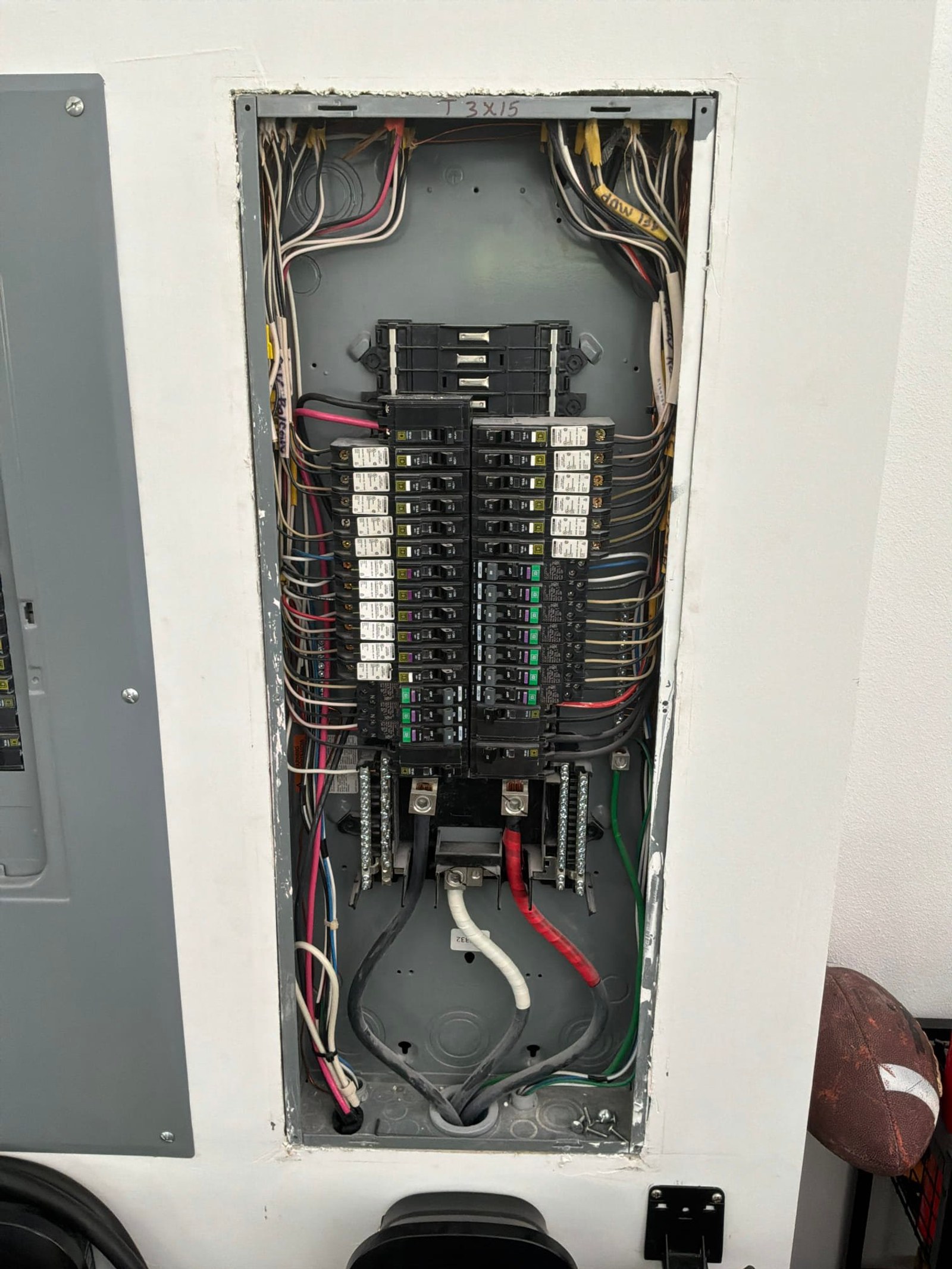 The inside of an electrical panel documented before the work on an Electric Fixture Service/Repair job in Jupiter, FL.