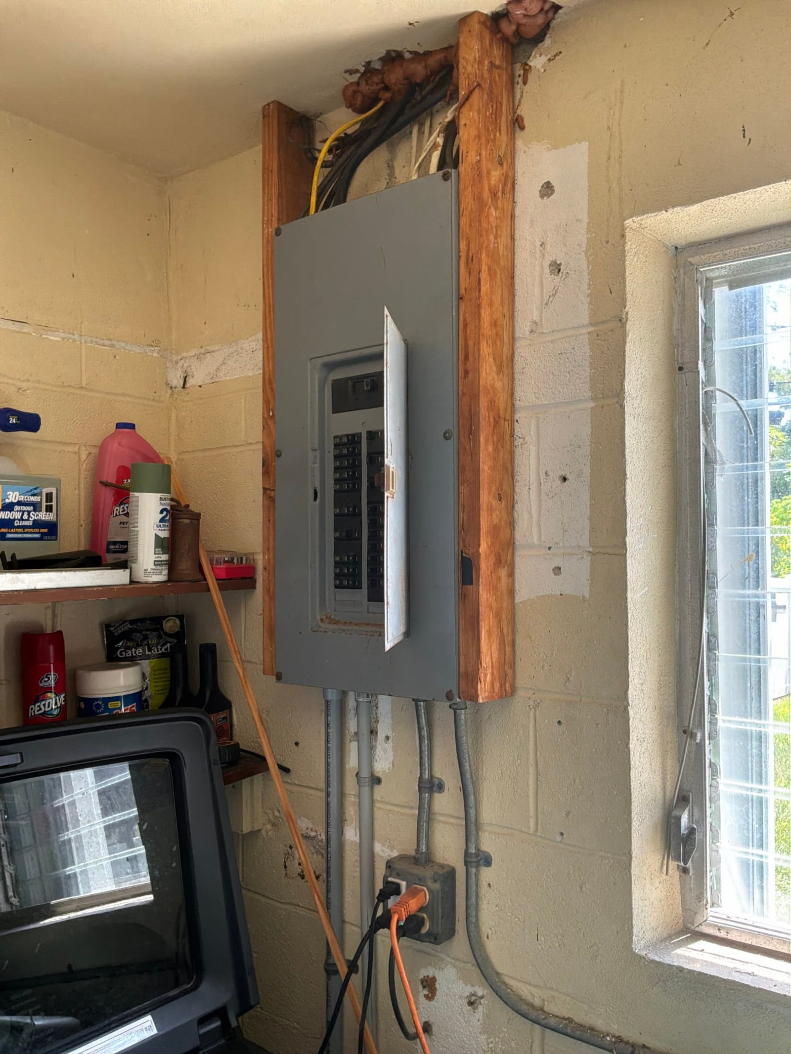 The panel feed lugs and service conductors documented before the work on a Panel Service/Repair job in Jupiter, FL.
