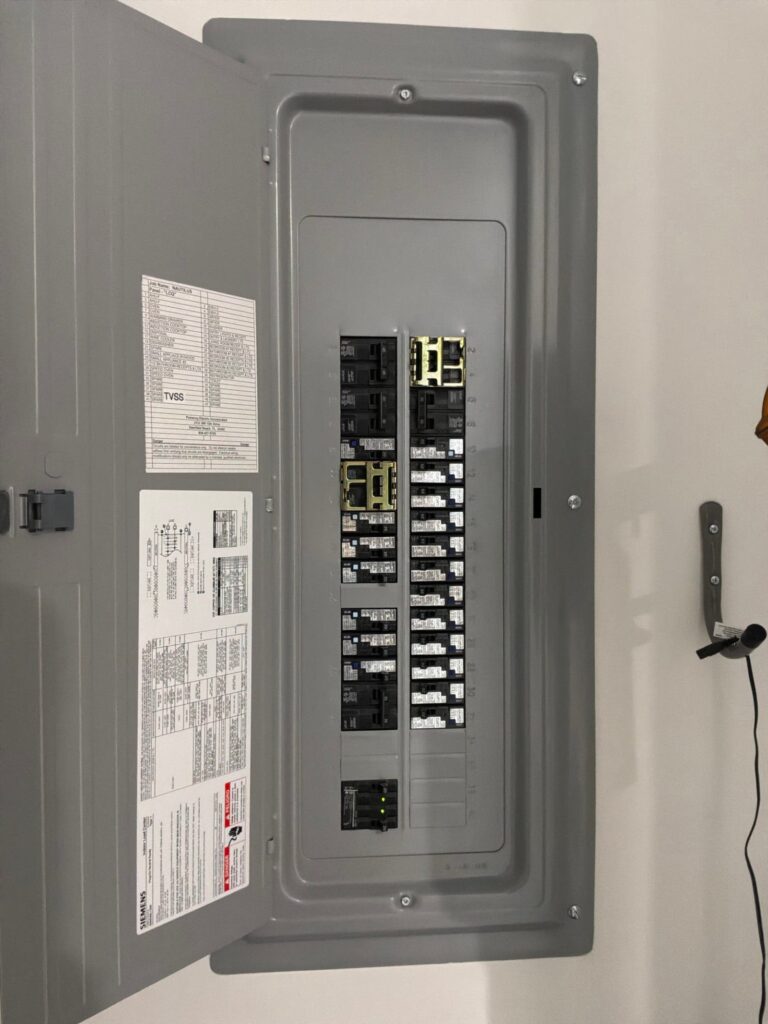 The inside of an electrical panel documented on an Outlet/GFCI-Repair/Replace job in Lake Park, FL.