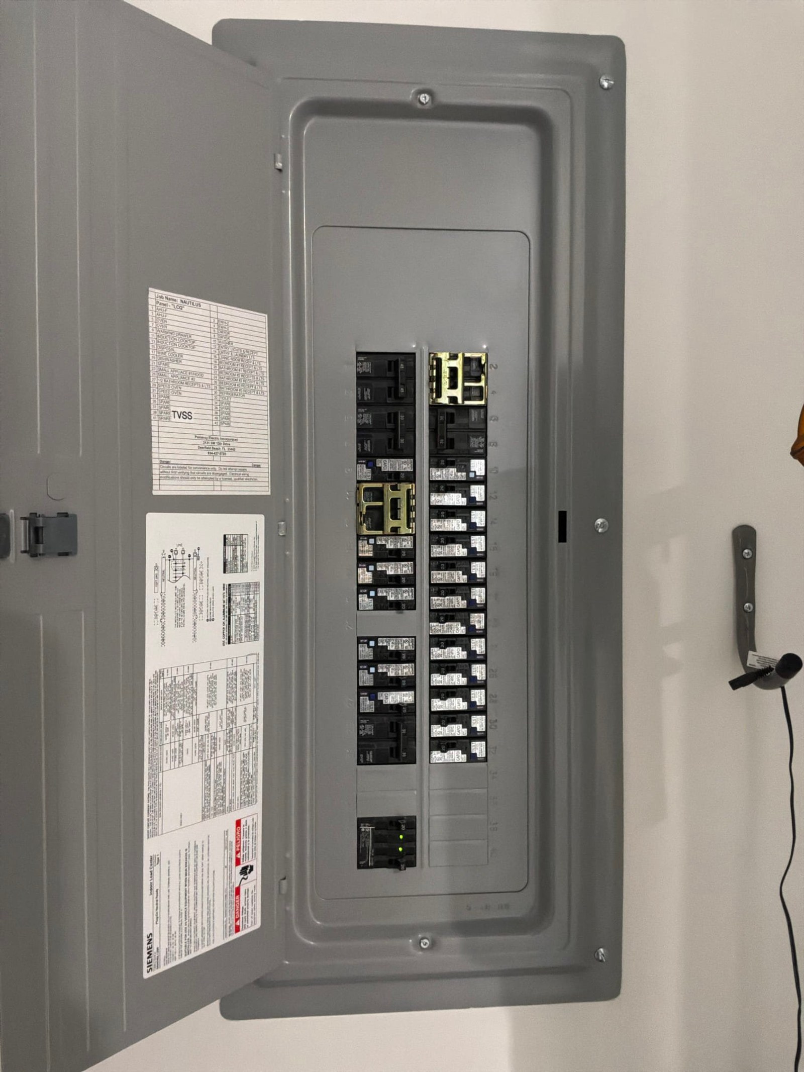 The inside of an electrical panel documented on an Outlet/GFCI-Repair/Replace job in Lake Park, FL - Lake Park outlet repair